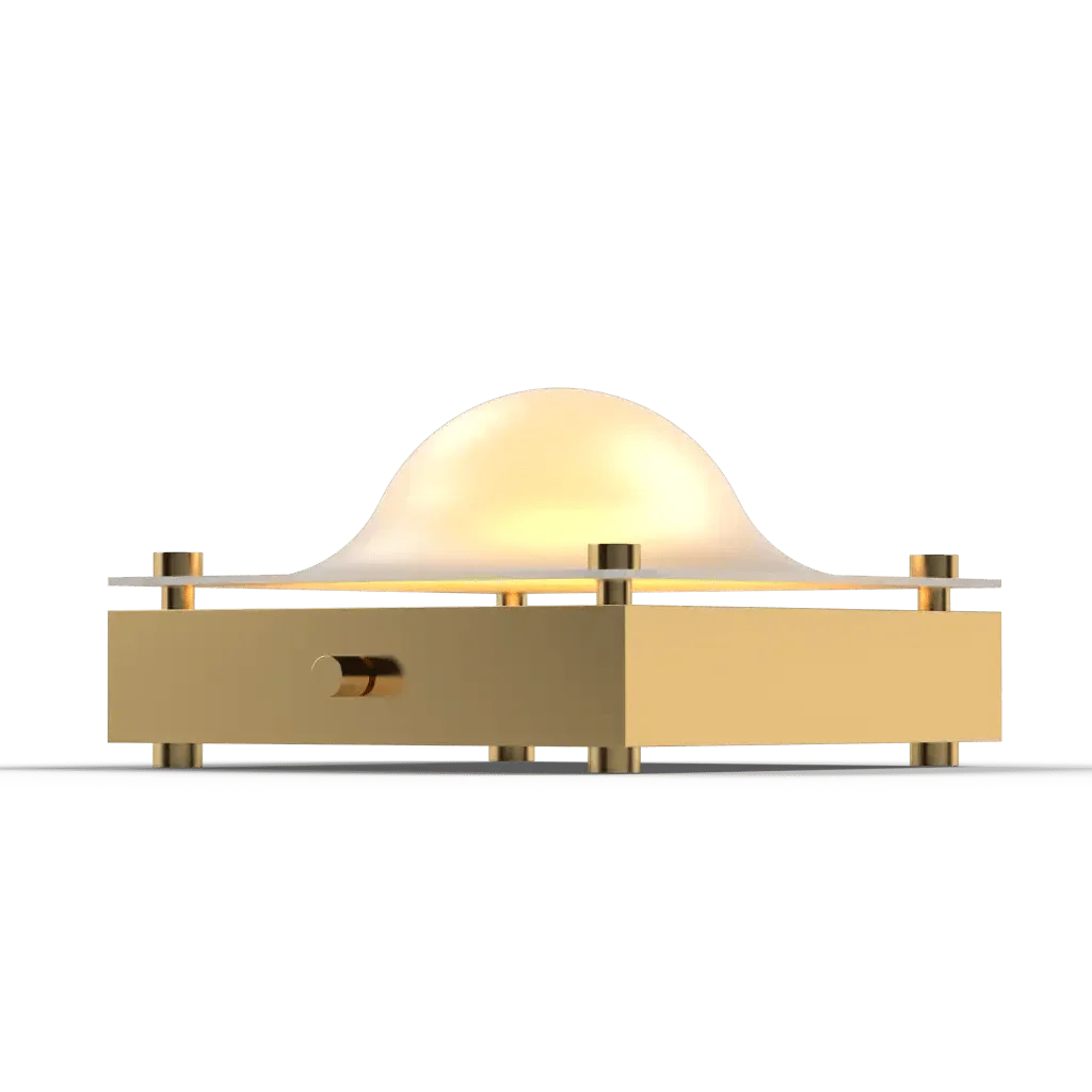 A golden art deco Cupola table lamp with a glowing domed shade ideal for stylish ambient lighting