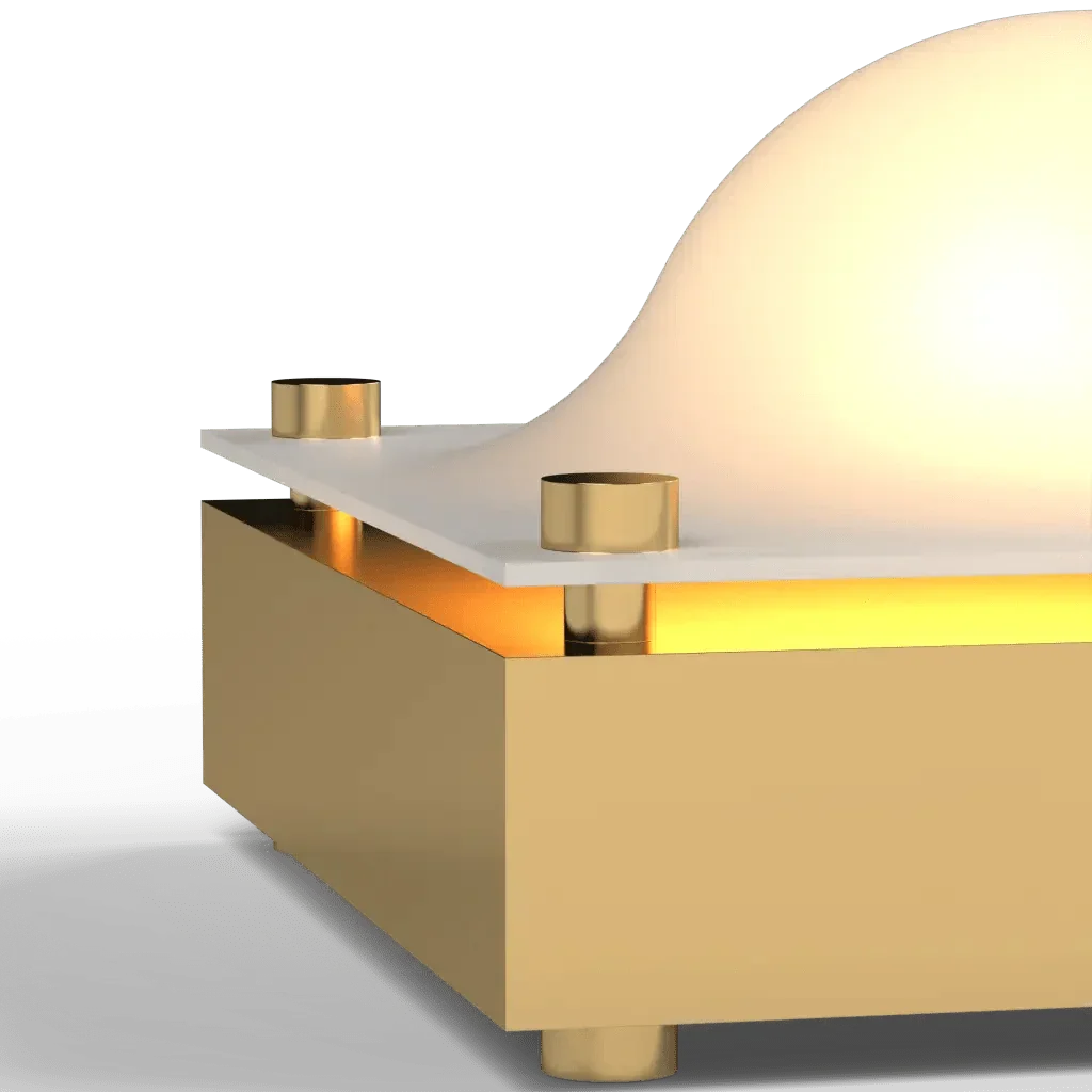 A modern gold finished cupola table lamp with a white curved diffuser designed for ambient lighting