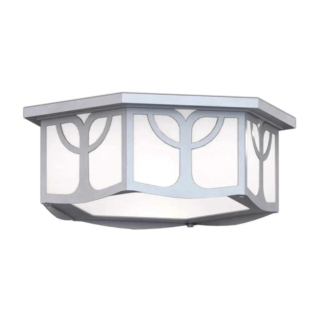 White hexagonal outdoor light fixture with decorative cutouts and a modern design.