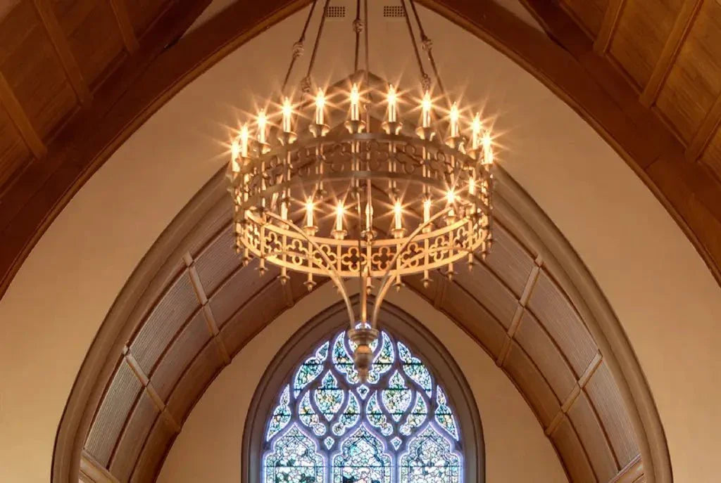 Ornate brass kylemore chandelier with multiple glowing lights for elegant indoor lighting