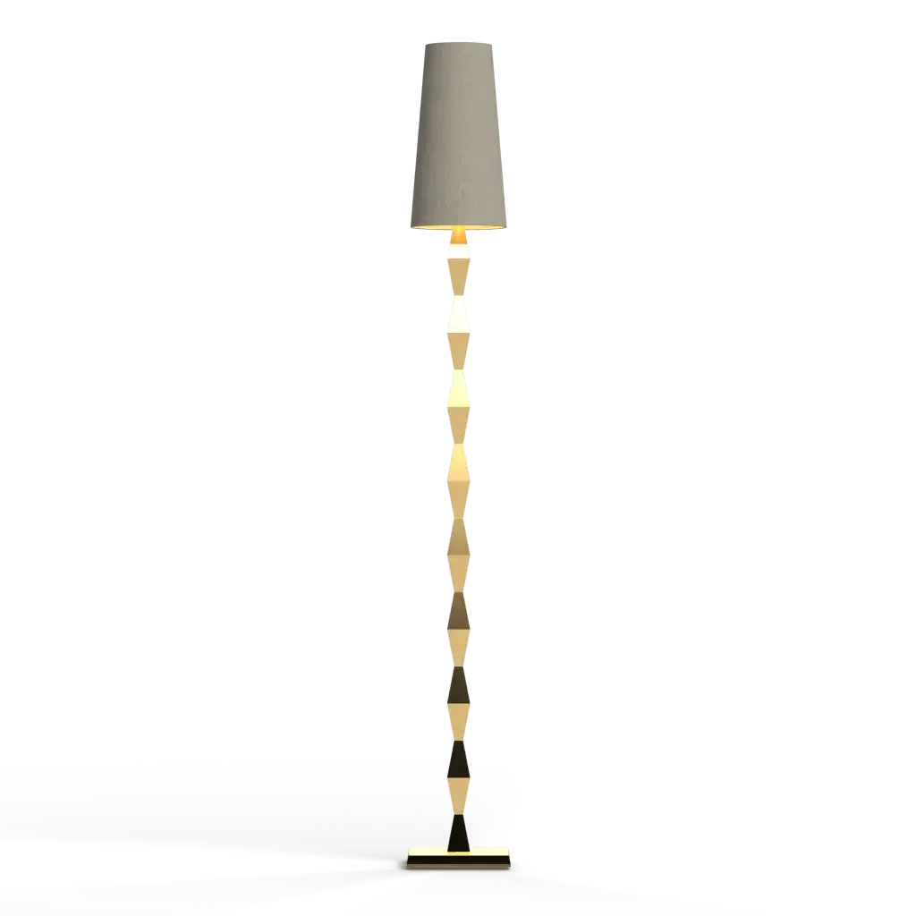 A tall slender pillar floor lamp with a light-colored cylindrical shade and segmented decorative stem