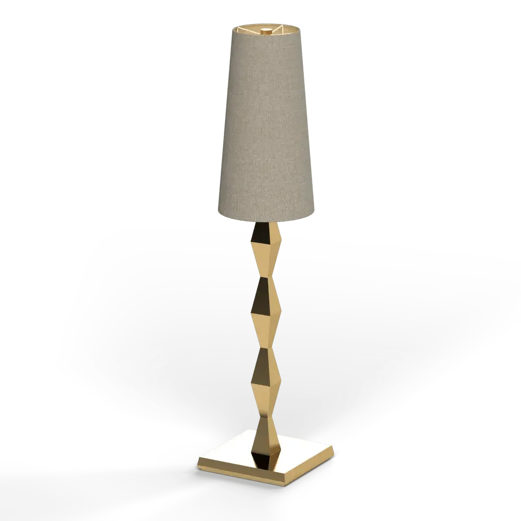Pillar table lamp with a beige tapered fabric shade and a gold geometric stacked metal base