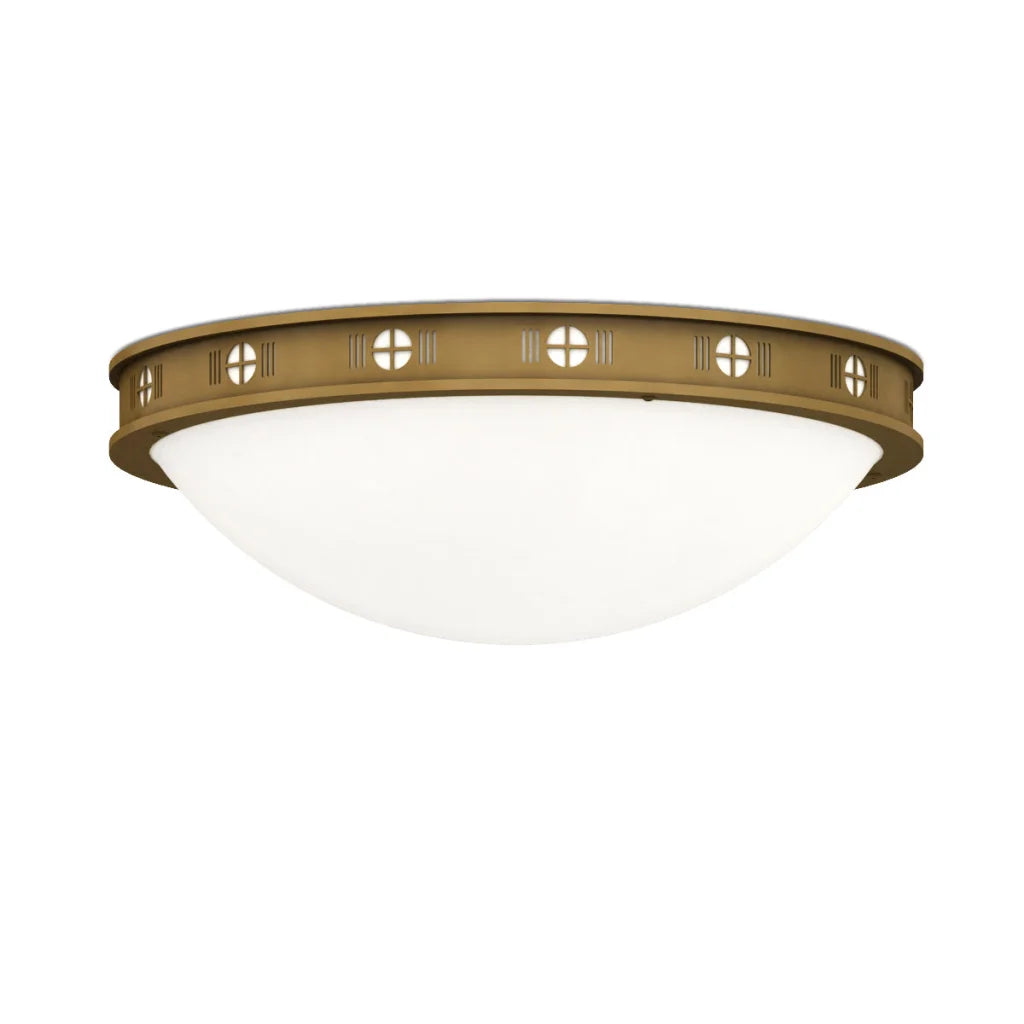 Brass-colored flush mount ceiling light with frosted glass shade and decorative cutouts.