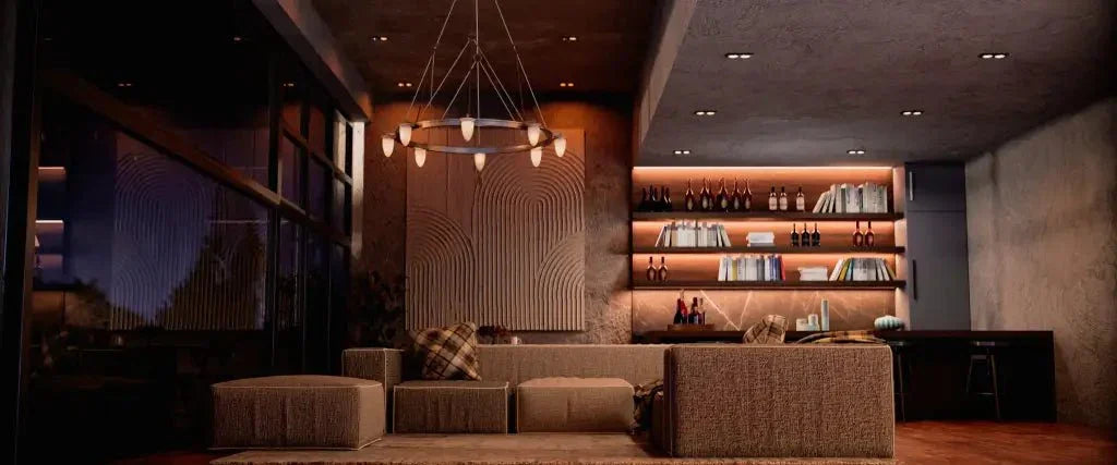Modern lounge area featuring the signet chandelier with elegant lighting above a bar and cozy seating arrangement