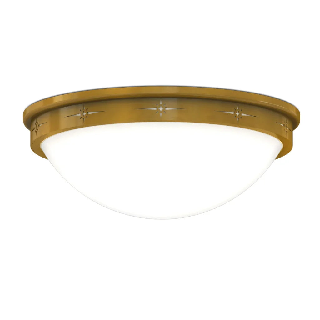 Gold-toned ceiling light with a frosted glass dome and decorative starburst patterns along the rim.