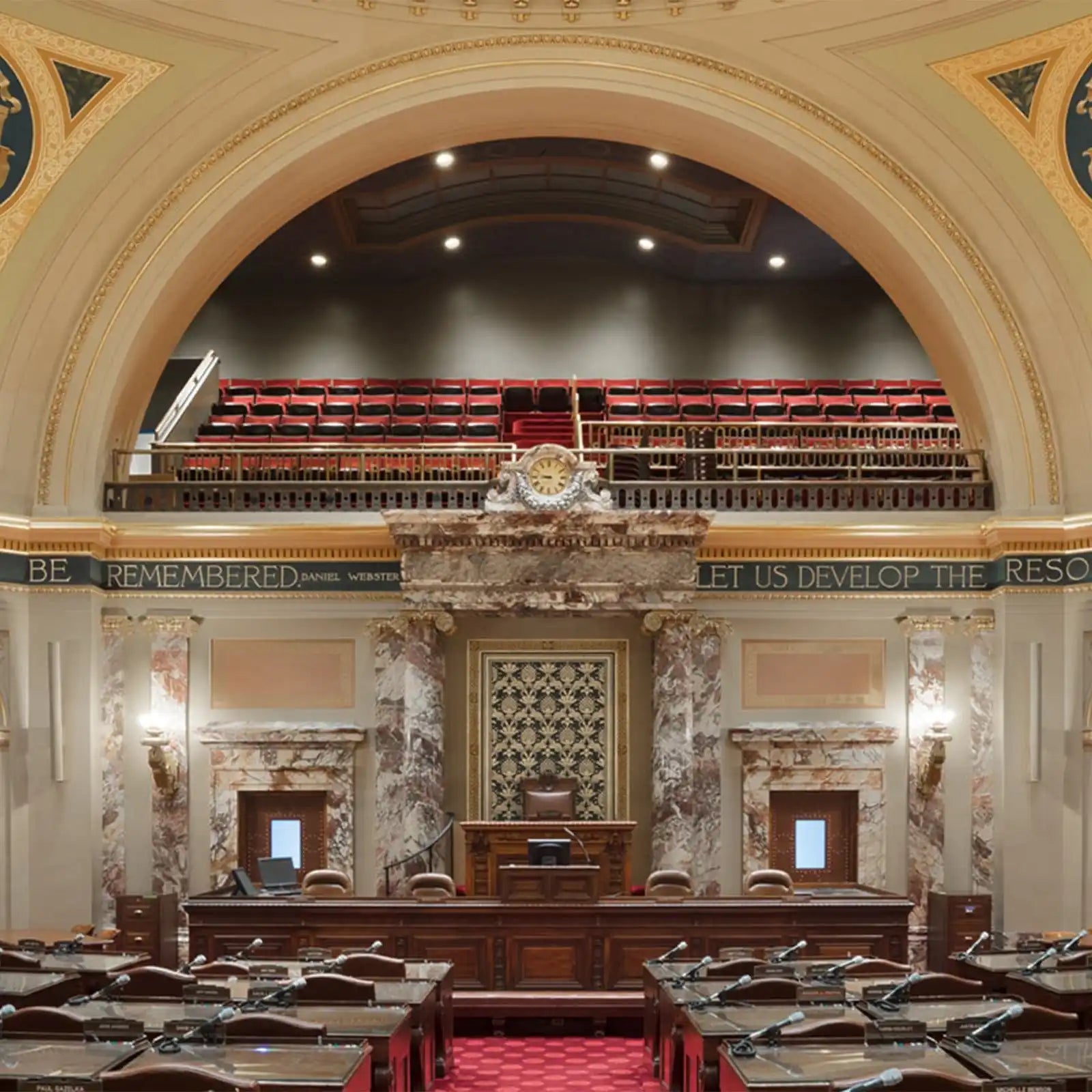 A legislative chamber or assembly hall with a grand, ornate design.