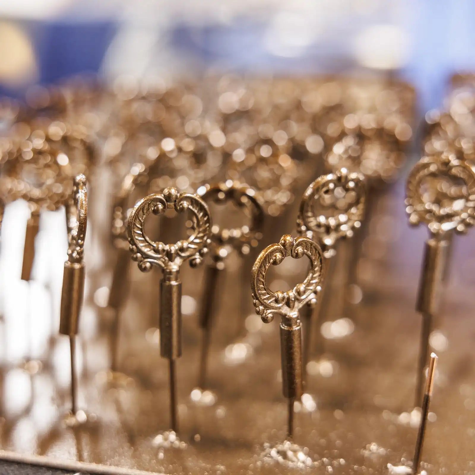 Ornate, antique-style metal keys with decorative handles.