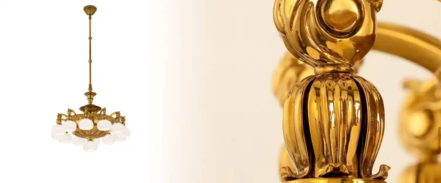 An ornate brass chandelier with multiple arms and white glass shades.