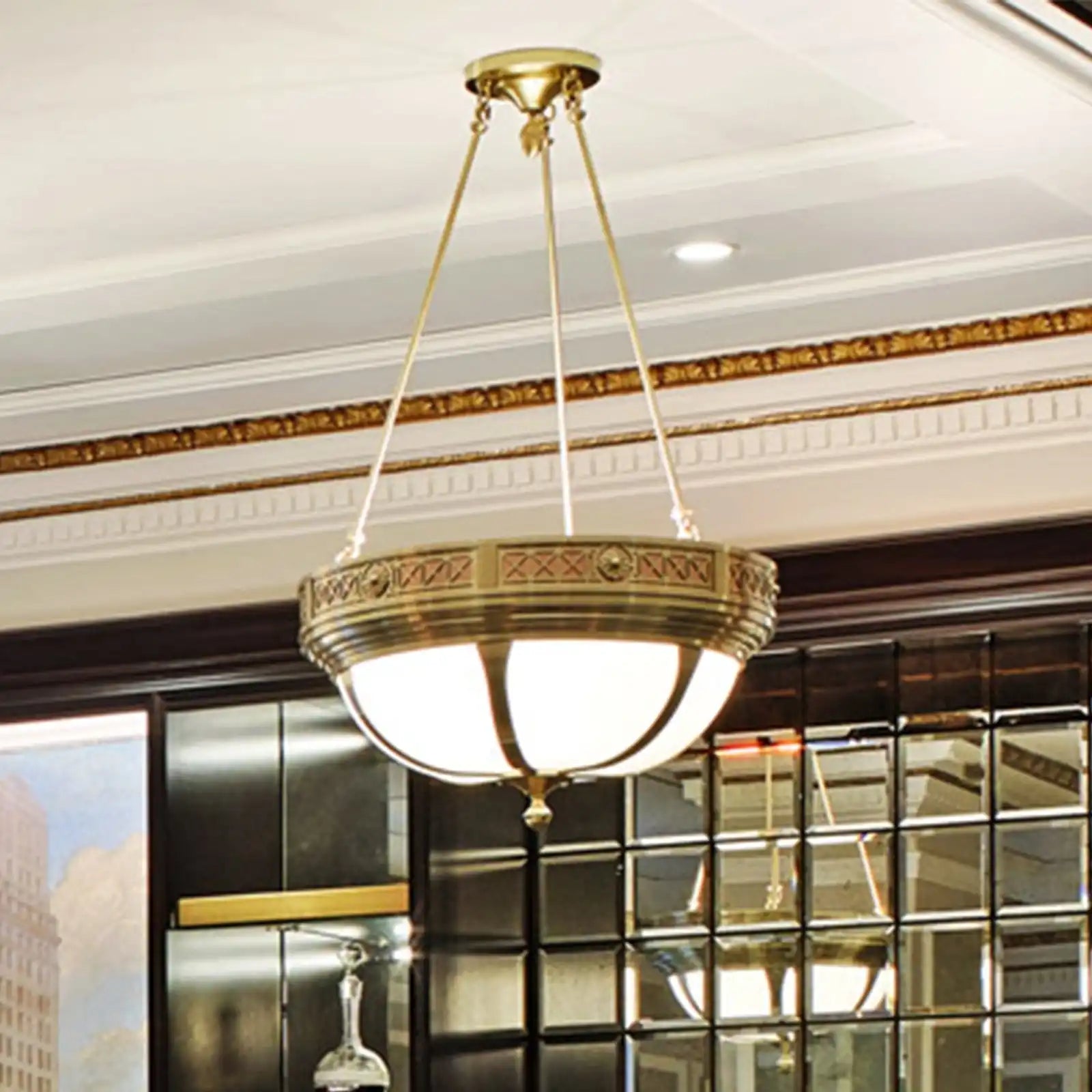 Ornate bronze and frosted glass bowl-shaped chandelier.