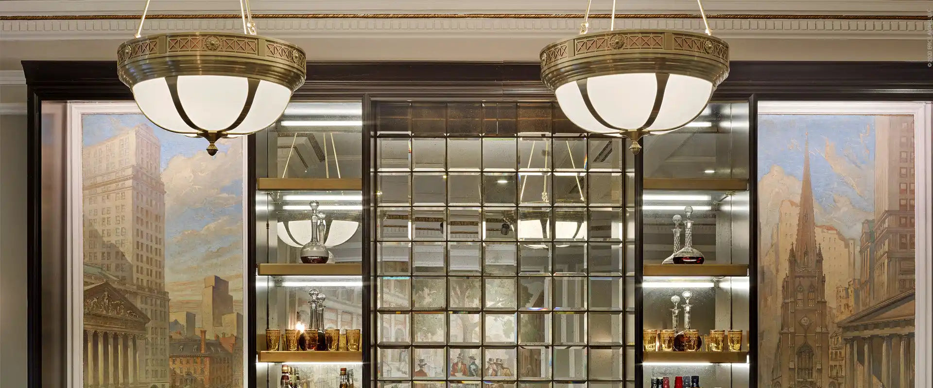 Two ornate, bowl-shaped ceiling lights with frosted glass panels and bronze-toned metal frames.