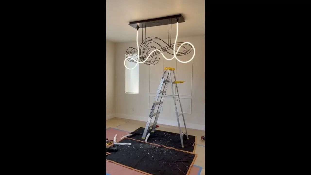 Modern black and white linear chandelier with wavy sculptural design in Crenshaw article