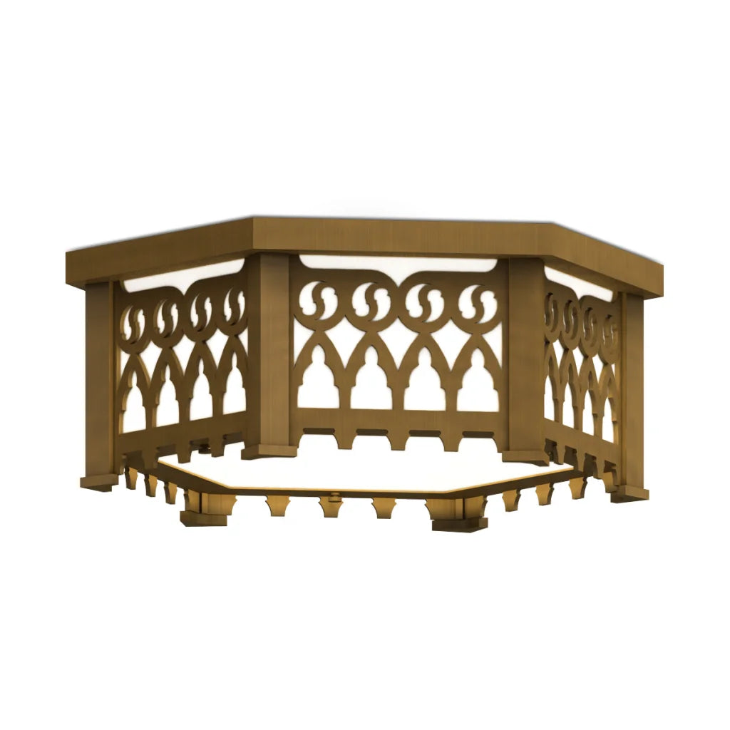 Gold hexagonal coffee table with intricate scrollwork design and wooden legs.