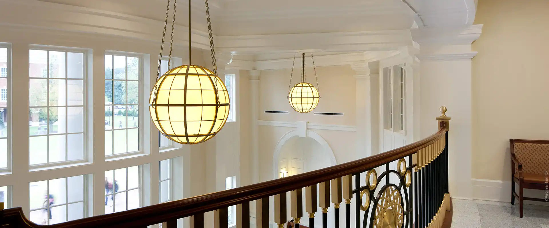 A spherical, caged pendant light fixture.